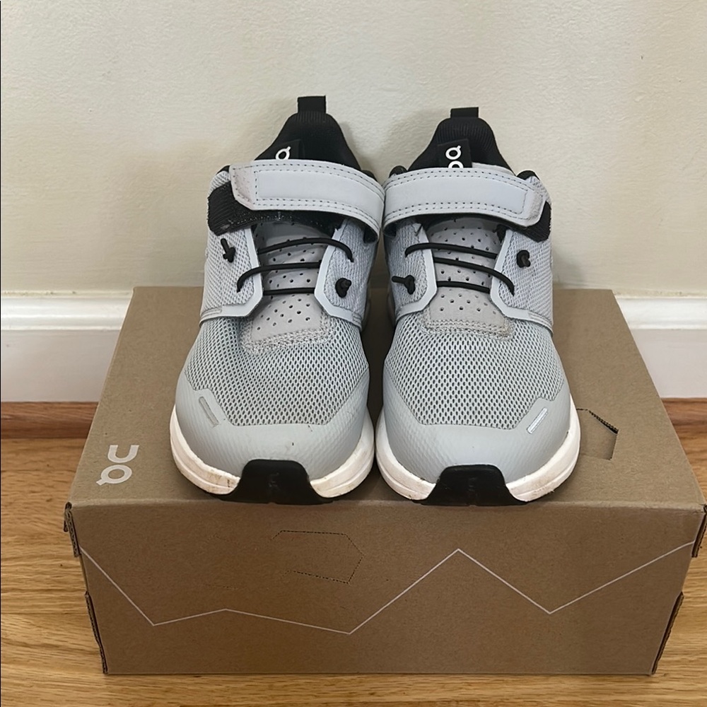 On Running Gray and Black Sneakers with Mesh Upper and Cushioned Midsole